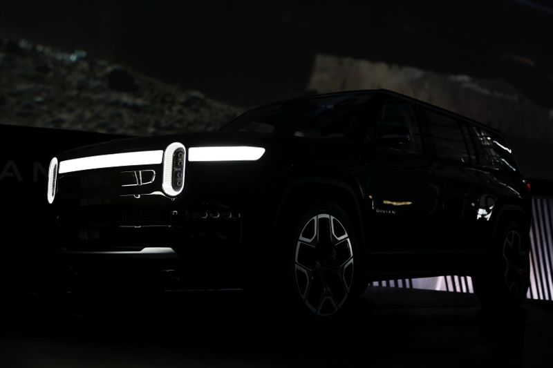 Rivian unveils smaller, less expensive EVs, hastens delivery plans By Reuters