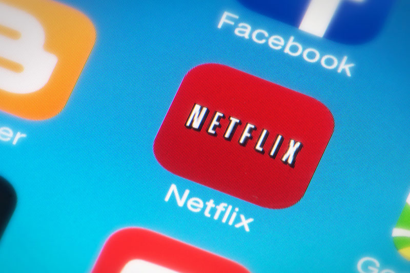 Netflix slides as move to end sharing user count sparks growth worries By Reuters